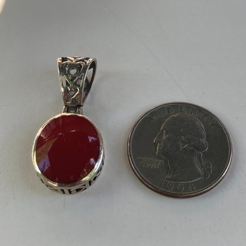 Lovely Silpada red carnelian gem in filigreed sterling silver pendant